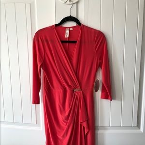 Coral dress with gold embellishment on the front